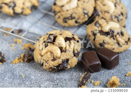 Close-up of Natural cocoa powder with brown cocoa beans and dry cacao pod  on a vintage wooden table. 133099030