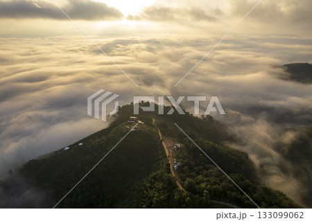 Landscape of Morning Mist with Mountain Layer. mountain ridge and clouds in rural jungle bush forest Landscape of Morning Mist with Mountain Layer. mountain ridge and clouds in rural jungle bush forest 133099062