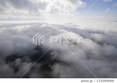 Landscape of Morning Mist with Mountain Layer. mountain ridge and clouds in rural jungle bush forest 133099066