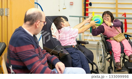 People with disabilities playing ball game for inclusion People with disabilities playing ball game for inclusion 133099998