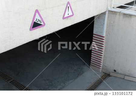 Parking Garage Entrance with Warning Signs 133101172