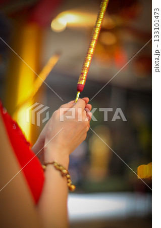 Pray in a Temple as Incense Sticks Burn, Creating a Colorful Ceremonial Scene,Chinese prayer, Chinese new year prayers Pray in a Temple as Incense Sticks Burn, Creating a Colorful Ceremonial Scene,Chinese prayer, Chinese new year prayers 133101473
