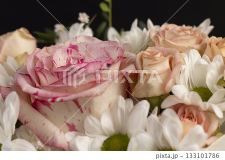 mix flowers of different colors, a flower arrangement for giving from different colors and different types of flowers 133101786