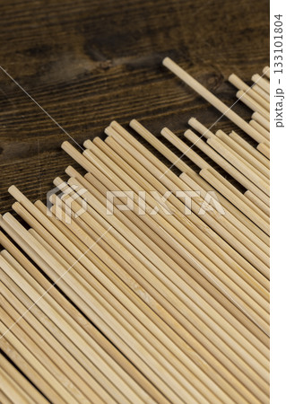 Thin round sticks are used as supports for indoor or other agricultural plants or for cooking, thin long sticks made of bamboo have a wide range of applications from cooking 133101804