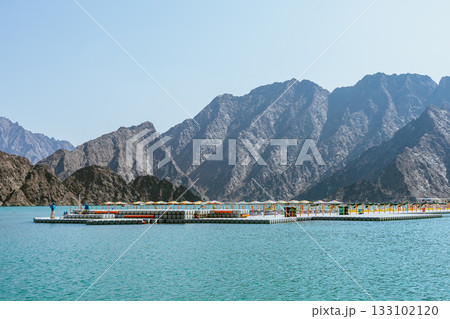 Hatta, UAE- 02112025: Beautiful view of Hatta Dam or Lake and Hajar Mountain in the Emirate of Dubai 133102120