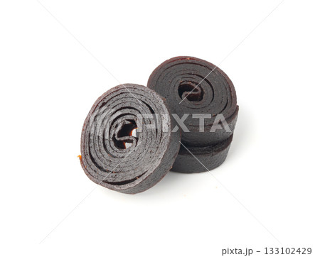Fruit leather rolls isolated. Plum apple pastila, pastille healthy candy snack Fruit leather rolls isolated. Plum apple pastila, pastille healthy candy snack 133102429