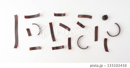 Fruit leather rolls isolated. Plum apple pastila, pastille healthy candy snack Fruit leather rolls isolated. Plum apple pastila, pastille healthy candy snack 133102438