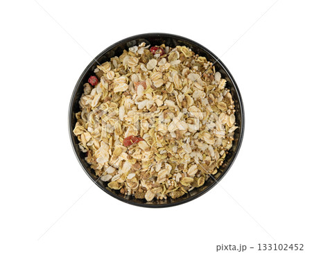 Muesli isolated. Crunchy granola with cereal mix, oat flakes, dry fruits, berries and fiber Muesli isolated. Crunchy granola with cereal mix, oat flakes, dry fruits, berries and fiber 133102452