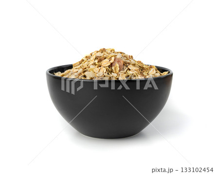 Muesli isolated. Crunchy granola with cereal mix, oat flakes, dry fruits, berries and fiber 133102454