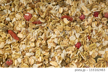 Muesli isolated. Crunchy granola with cereal mix, oat flakes, dry fruits, berries and fiber 133102463