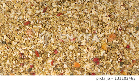 Muesli isolated. Crunchy granola with cereal mix, oat flakes, dry fruits, berries and fiber Muesli isolated. Crunchy granola with cereal mix, oat flakes, dry fruits, berries and fiber 133102465