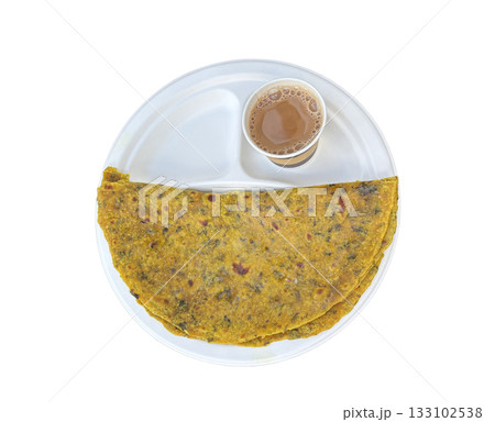 Indian paratha with masala tea. Layered flat bread with greens, hot naan, roti or chapati Indian paratha with masala tea. Layered flat bread with greens, hot naan, roti or chapati 133102538