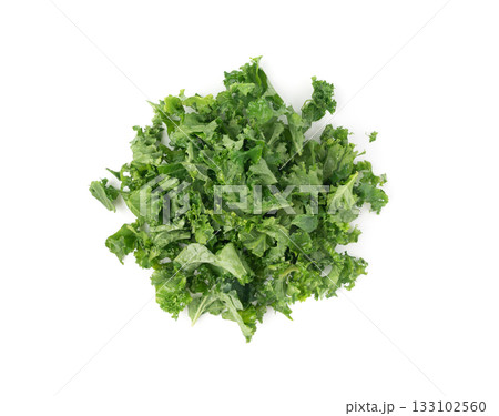 Pieces of kale cabbage leaves isolated. Green leaf of curly cabbage cooked for fresh salad Pieces of kale cabbage leaves isolated. Green leaf of curly cabbage cooked for fresh salad 133102560