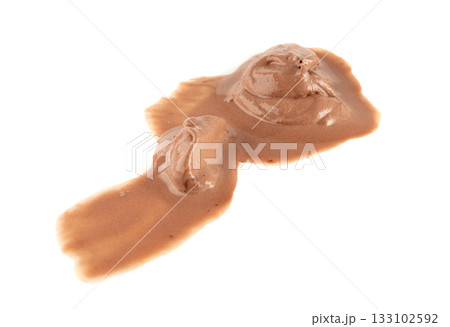 Melted chocolate ice cream isolated, real melting cocoa icecream drops, chocolate ice stain 133102592