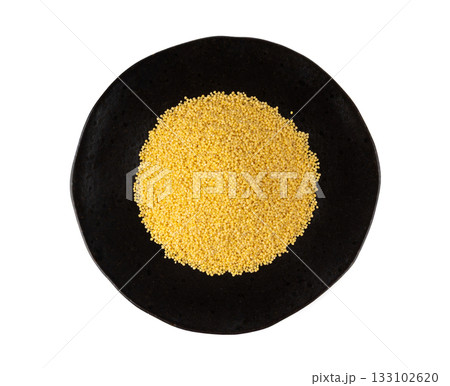 Raw millet grains pile isolated. Little yellow cereal, natural foxtail small seeds Raw millet grains pile isolated. Little yellow cereal, natural foxtail small seeds 133102620
