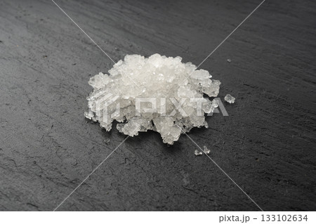 Dead sea salt pile, white crystals for body spa, sodium chloride similar to crushed ice, spa scrub 133102634