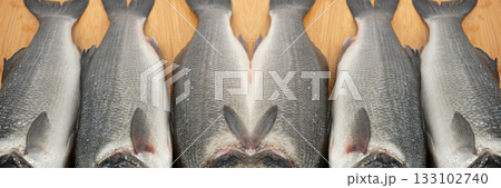 Fish scales texture background, sea bass skin close up, macro shot of silver labrax scale 133102740