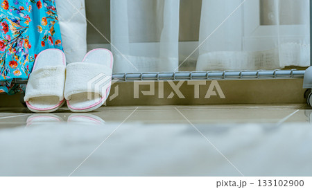 House slippers in a home interior, front view House slippers in a home interior, front view 133102900