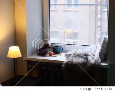 Soothing alcove beside window perfect for introspection and peace Soothing alcove beside window perfect for introspection and peace 133104218