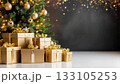 Luxurious Golden Gift Boxes Beneath Illuminated Christmas Tree with Sparkling Bokeh Background 133105253
