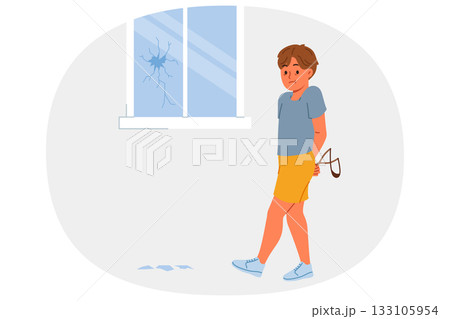 Hooligan boy broke window with slingshot and is afraid of punishment from parents for bad behavior Hooligan boy broke window with slingshot and is afraid of punishment from parents for bad behavior 133105954