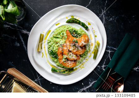 Green risotto with fried shrimp and asparagus Green risotto with fried shrimp and asparagus 133109485