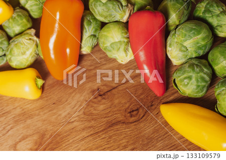 Raw brussel sprouts and mini bell peppers for a healthy, plant-based diet 133109579