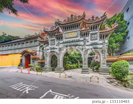Traditional temple gate in Taipei with ornate carvings at sunset Traditional temple gate in Taipei with ornate carvings at sunset 133110465