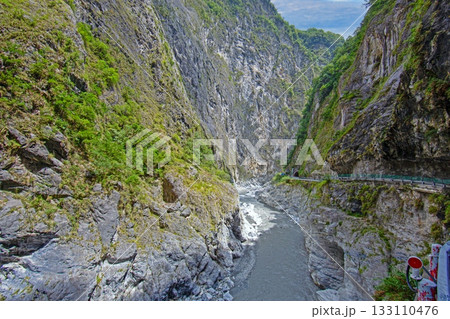 Taroko Gorge river between steep rock walls in Taiwan 133110476