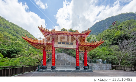 Traditional temple gate in Taiwan mountains under bright sky Traditional temple gate in Taiwan mountains under bright sky 133110482