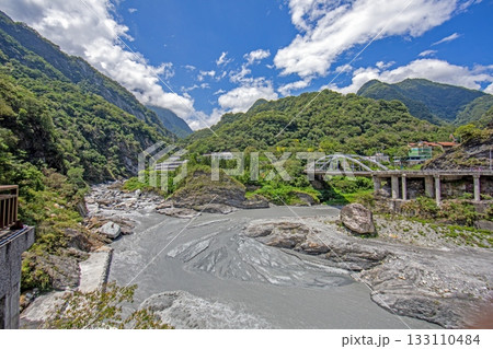 Taroko Gorge river and bridge in lush mountain scenery Taiwan Taroko Gorge river and bridge in lush mountain scenery Taiwan 133110484