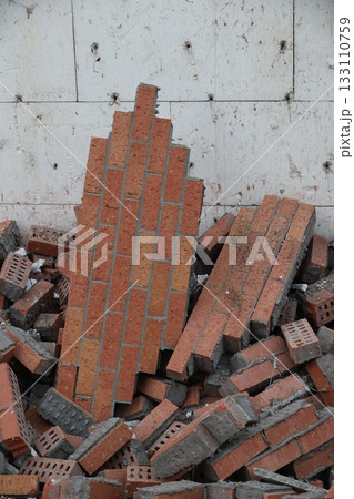 Collapsing Brick Wall Debris on Construction Site Collapsing Brick Wall Debris on Construction Site 133110759