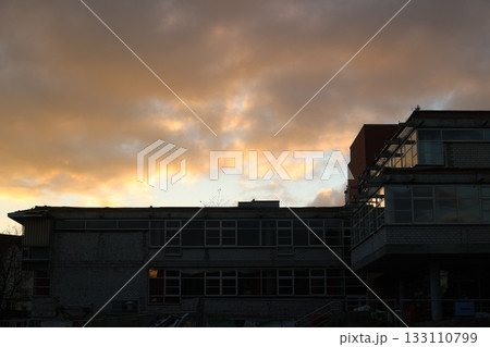 Dramatic Sunset Sky Over Modern Buildings Dramatic Sunset Sky Over Modern Buildings 133110799