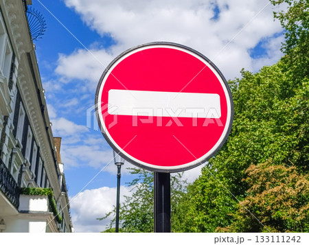 Do Not Enter road sign on urban street, red prohibition symbol Do Not Enter road sign on urban street, red prohibition symbol 133111242