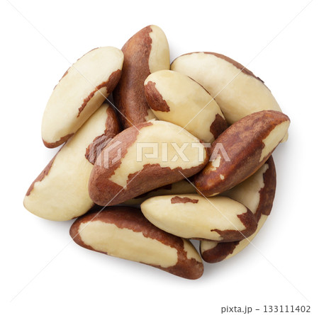 Pile of Brazil nuts on a white background. Top view Pile of Brazil nuts on a white background. Top view 133111402