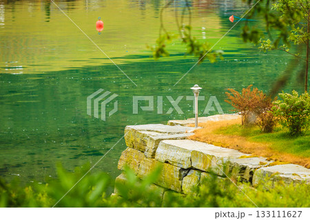 Garden decoration near lake water Garden decoration near lake water 133111627