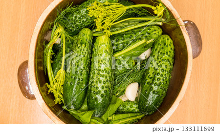 Making pickled cucumbers in clay jar Making pickled cucumbers in clay jar 133111699