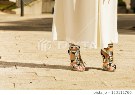 Woman wearing high heels and culottes Woman wearing high heels and culottes 133111760