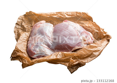 Isolated raw turkey thigh on paper Isolated raw turkey thigh on paper 133112168