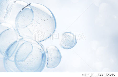 Aqua gel cream drops with bubbles floating on light blue 3d background. Liquid cosmetic water or lotion for skincare. Moisture collagen serum balls, jelly oil texture with hyaluron. 3D illustration 133112345