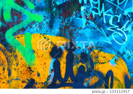 Vibrant Graffiti Texture in Neon Blue and Yellow for 90s Urban Style Vibrant Graffiti Texture in Neon Blue and Yellow for 90s Urban Style 133112457