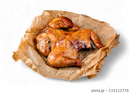 Isolated roasted chicken on parchment sheet 133112778