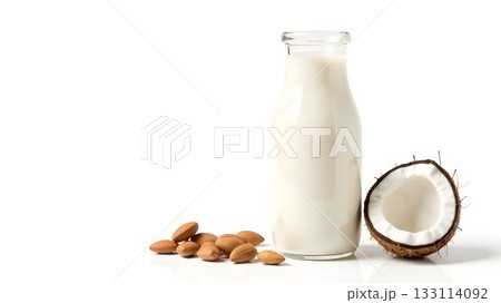 Almond and coconut milk with nuts on a white background for healthy beverage ideas Almond and coconut milk with nuts on a white background for healthy beverage ideas 133114092
