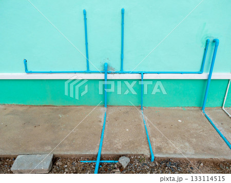 PVC Drain Pipe Installation Behind Residential Bathroom. PVC Drain Pipe Installation Behind Residential Bathroom. 133114515