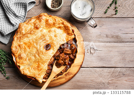 Beef steak pie with dark beer and crispy puff pastry Beef steak pie with dark beer and crispy puff pastry 133115788