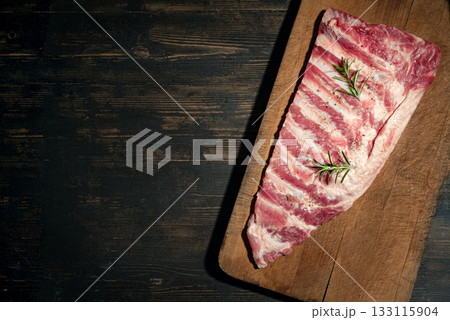 Raw pork ribs on wooden table 133115904