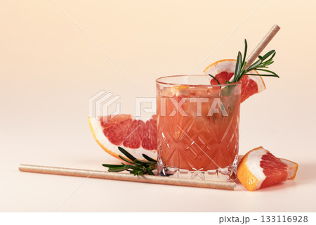 Summer cocktail with grapefruit, rosemary, and ice. Summer cocktail with grapefruit, rosemary, and ice. 133116928