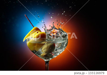 Martini with green olives and lemon. 133116979