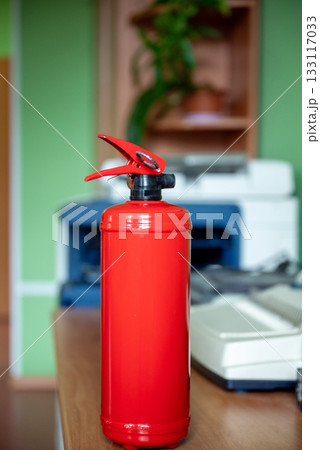 Fire extinguisher in workplace office Fire extinguisher in workplace office 133117033