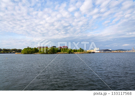 Sustainable cabins with natural materials on waterfront in Kvillepiren, Hisingen, sunny day, Gothenburg, Sweden Sustainable cabins with natural materials on waterfront in Kvillepiren, Hisingen, sunny day, Gothenburg, Sweden 133117568